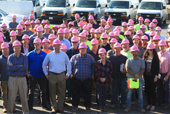 TMI employees wearing pink safety hats for their Safety Days event
